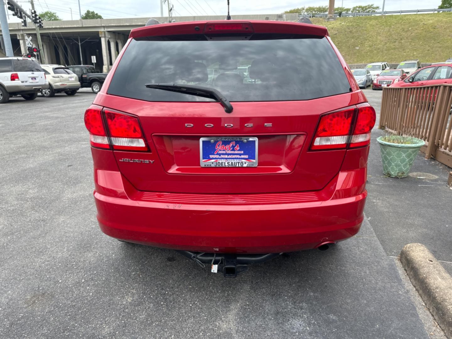 2012 Red /black Dodge Journey SE (3C4PDCAB8CT) with an 2.4L L4 DOHC 16V engine, 4-Speed Automatic transmission, located at 5700 Curlew Drive, Norfolk, VA, 23502, (757) 455-6330, 36.841885, -76.209412 - Photo#2